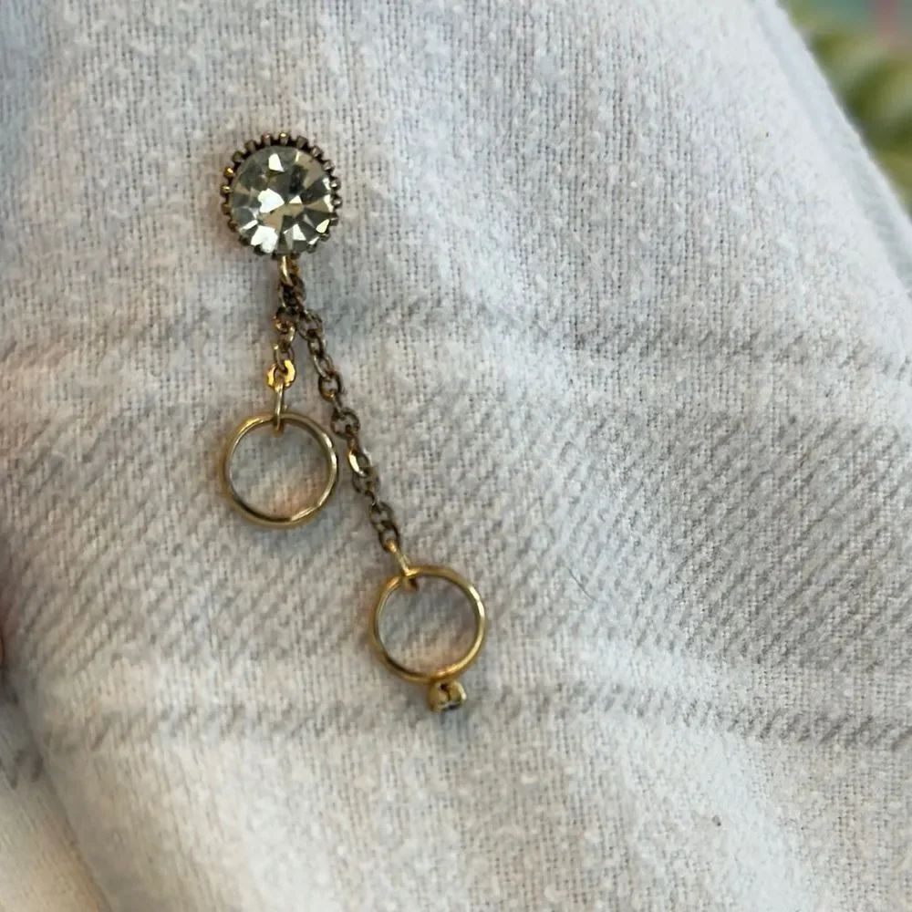 Vintage Lapel Pin with large “diamond” like jewel and dangling wedding rings